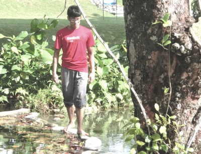 Balancing on rocks while being mindful of breathing.