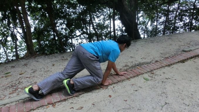 Foot-hand crawl while being aware of the breathe (movement training mindfulness)