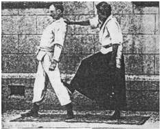 Shihan Yoshinori (Yazo) Eguchi of Kyushin Ryu Jujitsu on the right, with Edward William Barton-Wright, performing a Jujitsu demonstration.