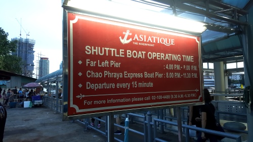 Asiatique ferry sign with operating hours